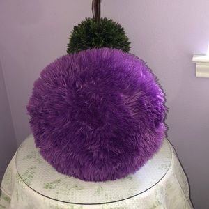 Purple furry circular throw pillow
